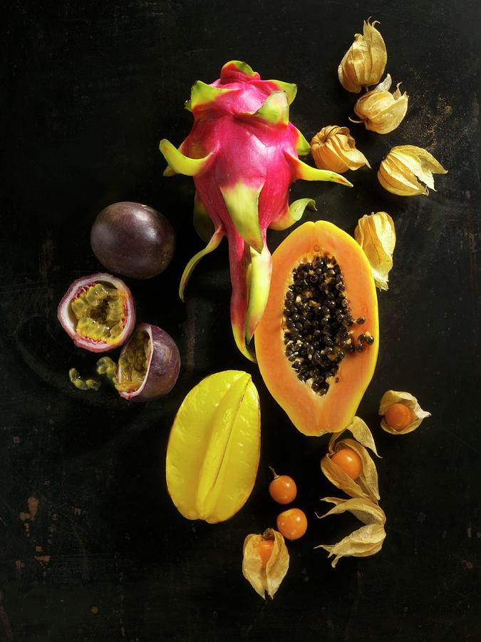 Exotic Fruit On A Black Surface Photograph by Linda Sonntag