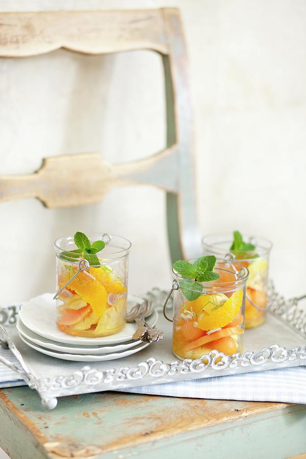 Exotic Fruit Salad Made With Oranges And Papaya With Fresh Mint Photograph by Jalag / Wolfgang Schardt