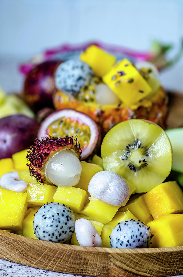 Exotic Fruits On A Wooden Tray Photograph by Gorobina