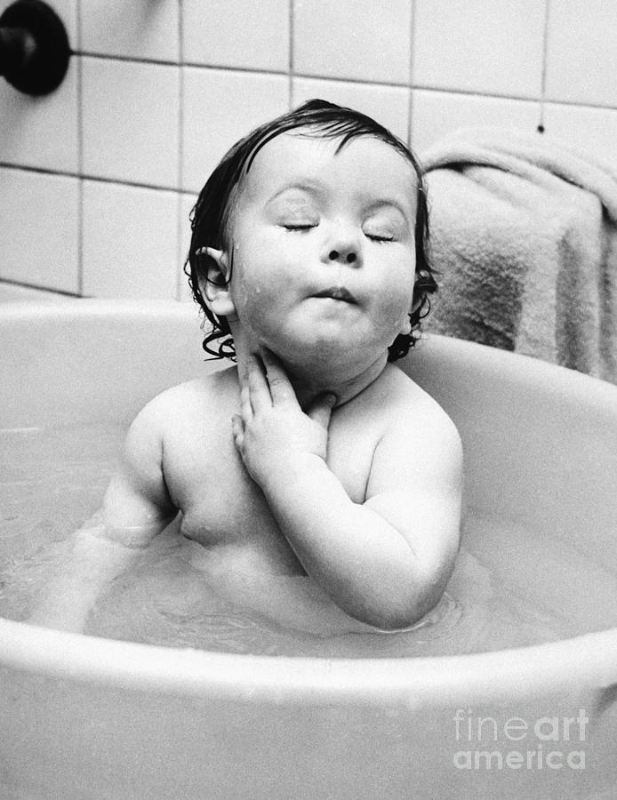 Expressive Infant Girl Bathing Photograph by Bettmann