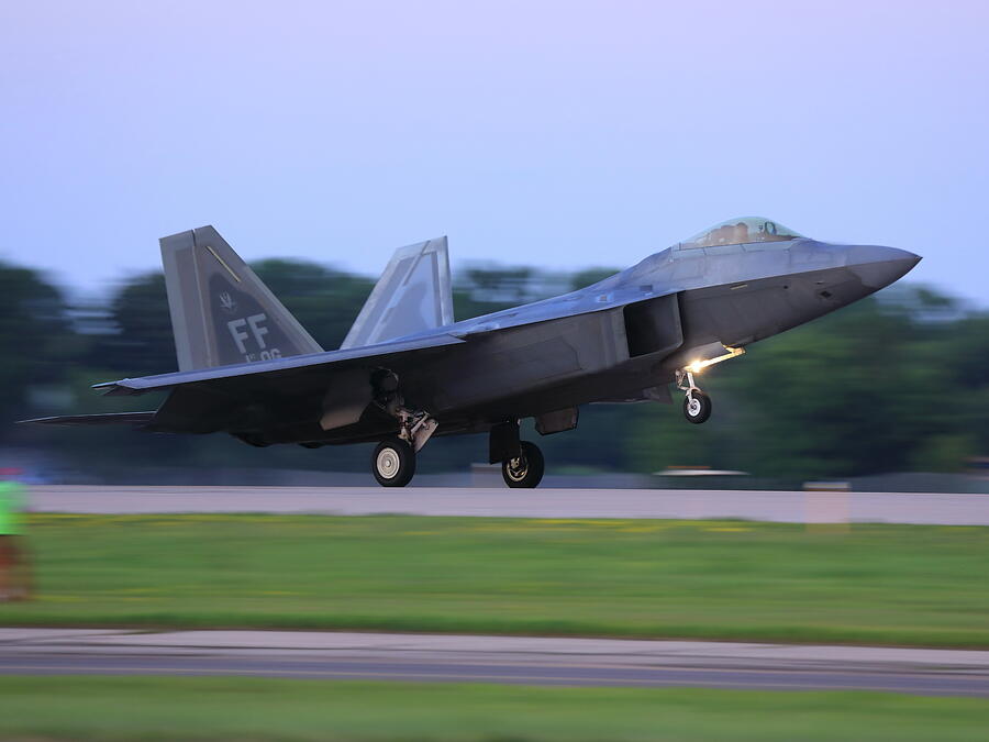 F22 landing Photograph by Alex Nikitsin - Pixels