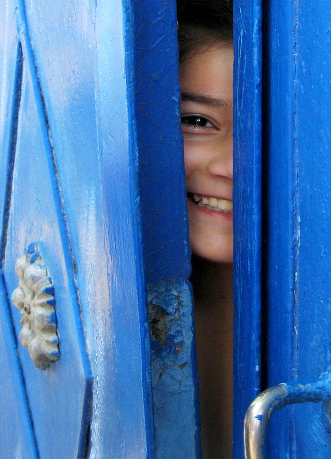 Face Behind Blue Door Photograph by Aliza Riza