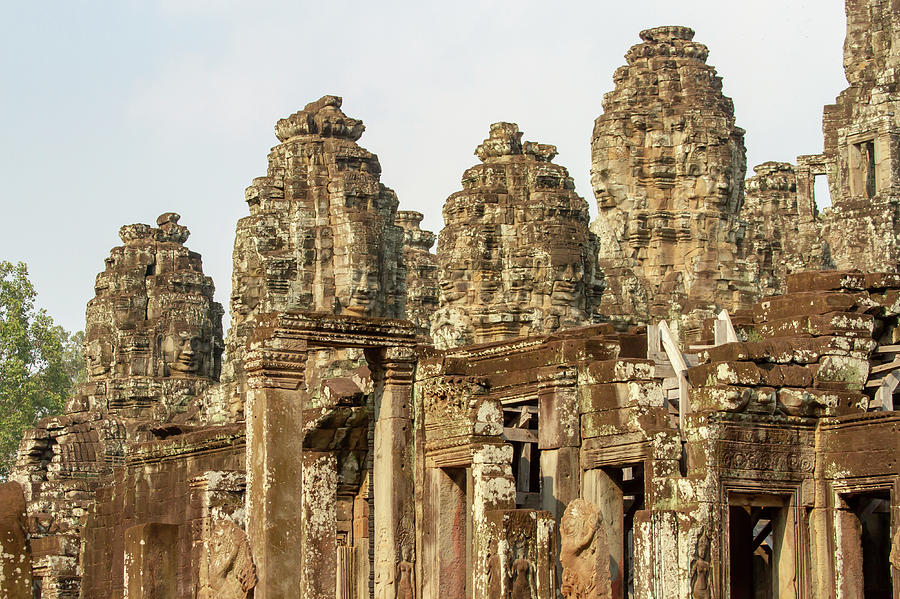 Faces on towers at Bayon Temple in Angkor Tom, Siem Reap, Cambod Photograph by Karen Foley