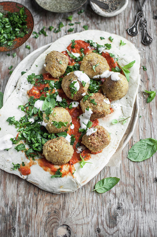 Falafel Served On Lavash With Roasted Tomatoes Sauce, Fresh Parsley And Garlic Yoghurt Sauce Photograph by Kachel Katarzyna