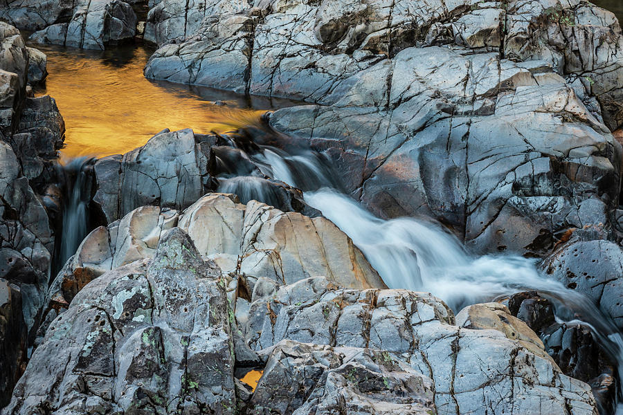 Fall colors tumble through Johnson Shut-ins State Park in Mo. Photograph by Jack Clutter