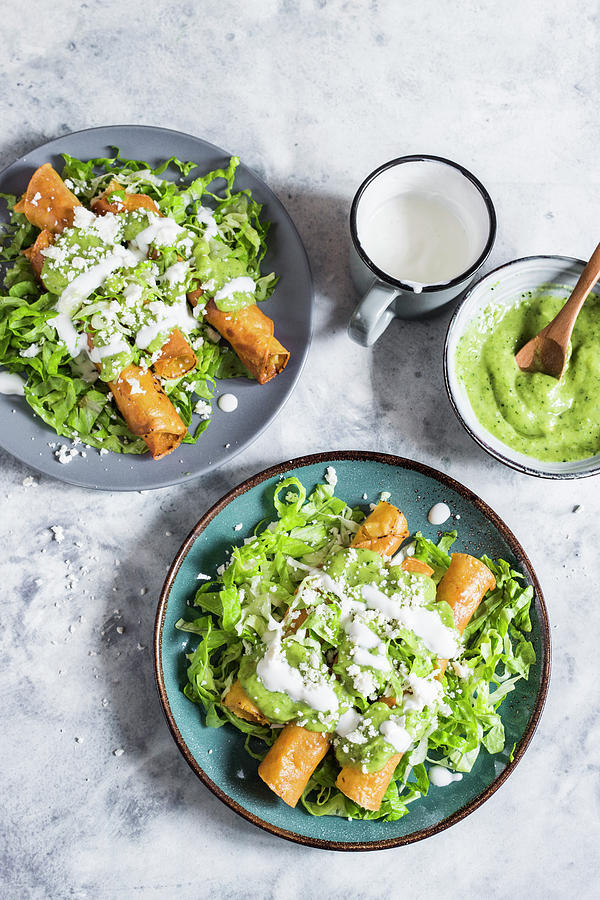 Falutas fried Taco Rolls With Chicken On Salad With Avocado Sauce, Sour Cream And Cheese Photograph by Maricruz Avalos Flores