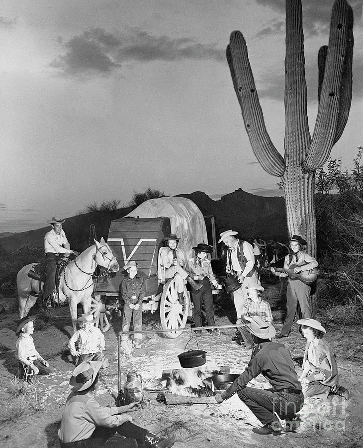 Families Around Campfire At A Dude Ranch Photograph by Bettmann