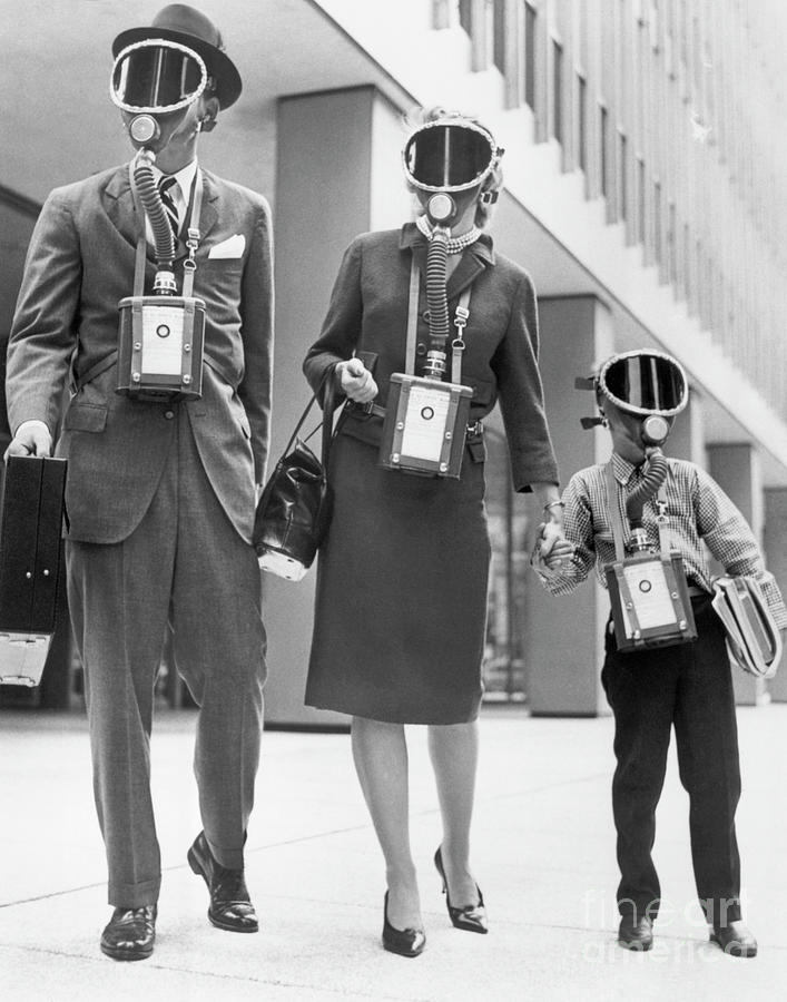 Family Displaying Gas Masks Photograph by Bettmann