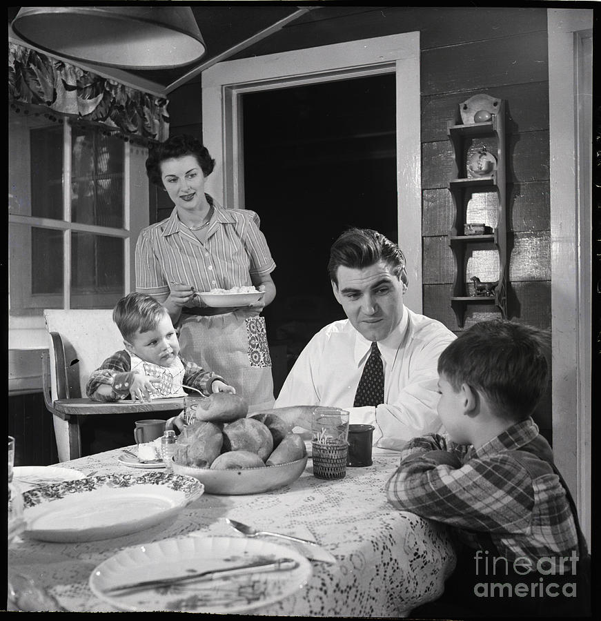Family Having Dinner Photograph by Bettmann