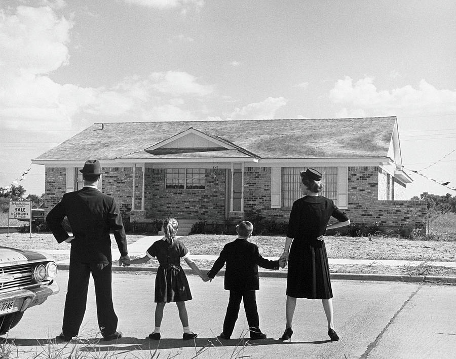 Family Holding Hands, Looking At A Photograph by Archive Holdings Inc. Family Holding Hands, Looking At A Photograph by Archive Holdings Inc.