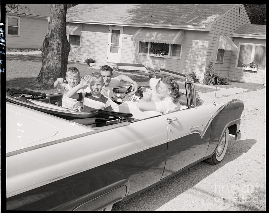 Family In Convertible Waving Photograph by Bettmann