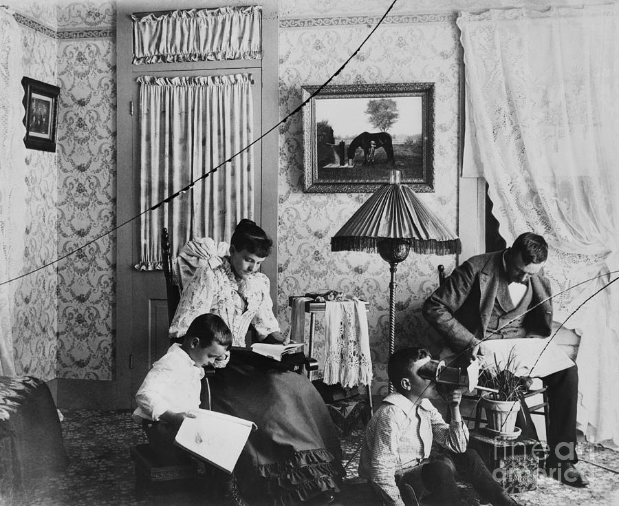 Family Relaxing At Home Photograph by Bettmann