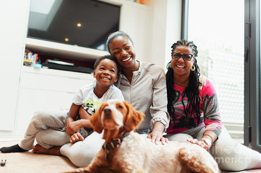 Affection Photograph - Family With Dog On Living Room Floor by Caia Image/science Photo Library Affection Photograph - Family With Dog On Living Room Floor by Caia Image/science Photo Library