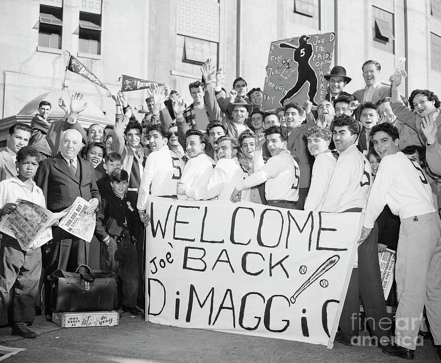 Fans Hold Signs Welcoming Joe Dimaggio Photograph by Bettmann