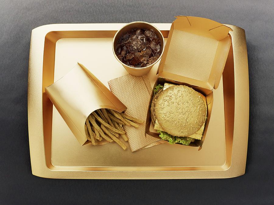Fast Food With A Gold-coloured Disposable Food Set Photograph by Ellert, Luzia