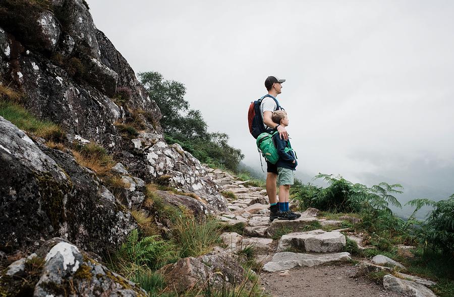 Father And Son Climbing Ben Nevis Mountain Range In The Uk Photograph ...