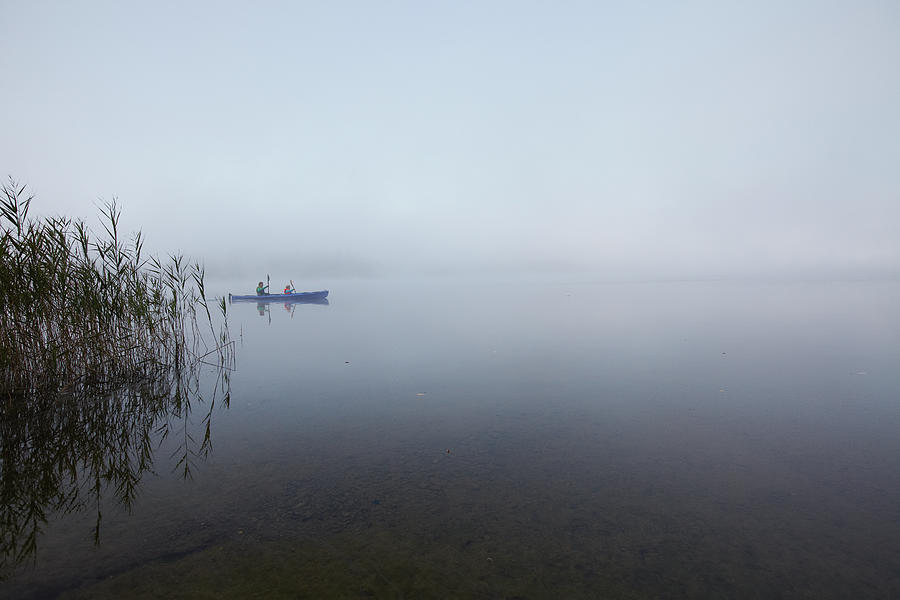 Father And Son Paddling In A Canoe On A Photograph by Poncho