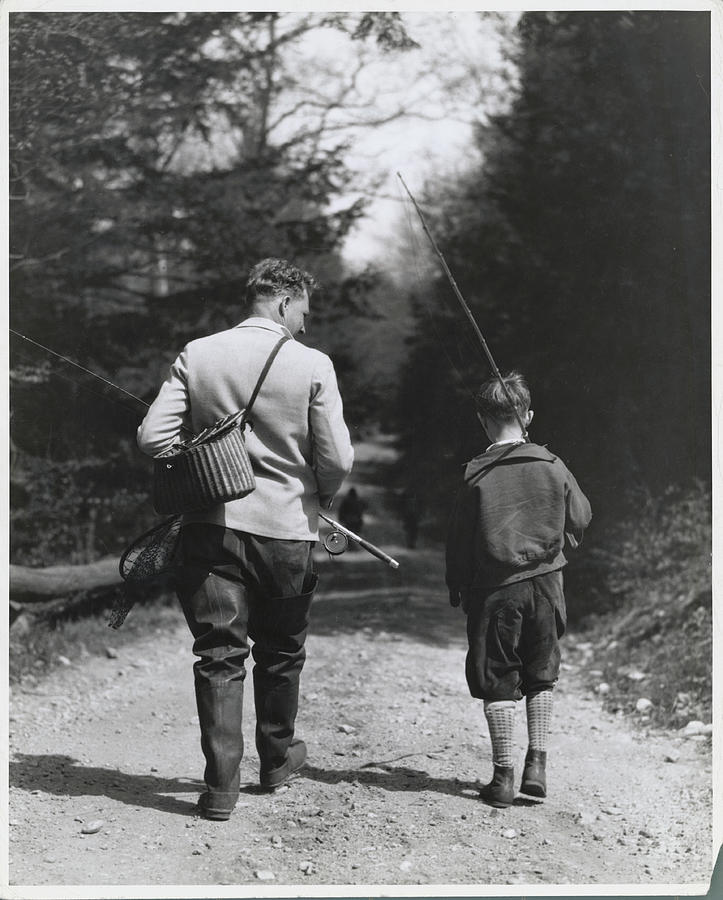 Father And Son Strolling For Fishing In Photograph by Bettmann