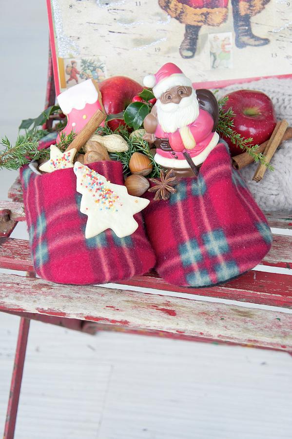 Father Christmas And Christmas Biscuits In Felt Slippers Photograph by Martina Schindler