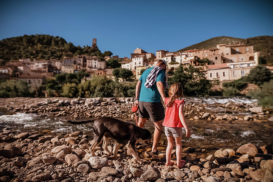 Summer Photograph - Father, Daughter And Dog Arrive At The River In South Of France by Cavan Images