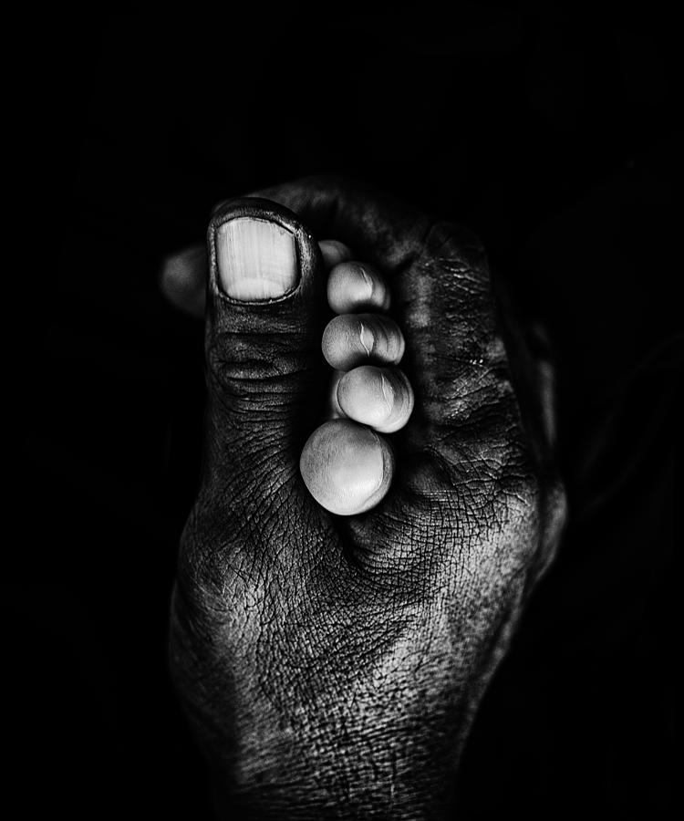 Black And White Photograph - Father Hand And His Doughter Feet by Andi Halil