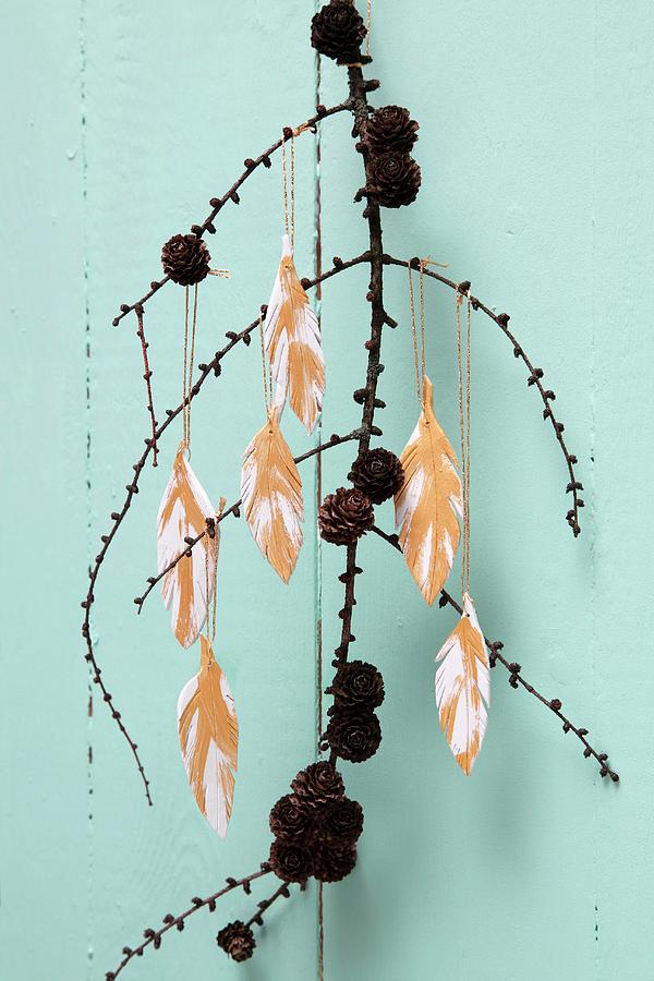 Feather Necklace And Pendant Hand-crafted From Polymer Clay Hanging From Branch Photograph by Thordis Rggeberg