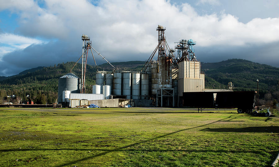 Feed Mill under Clouds Photograph by Tom Cochran