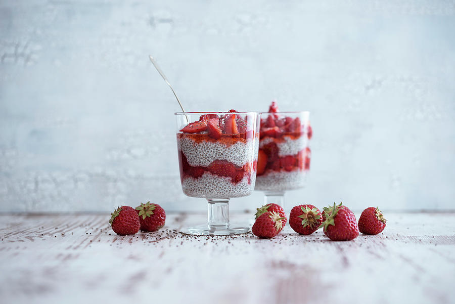 Feeding Coconut And Chia Seed Pudding With Fresh Strawberries Photograph by Kati Neudert