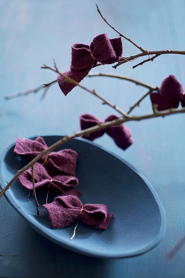 Felt Bows On Branch And In Blue Bowl Photograph by Alicja Koll
