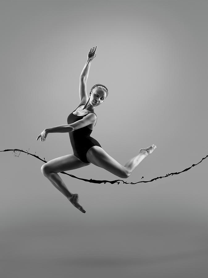 Female Athlete With Liquid Splah In Photograph by Jonathan Knowles