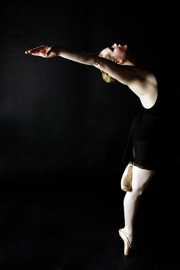 Female Ballerina Dancer Balancing On Photograph by Charity Burggraaf