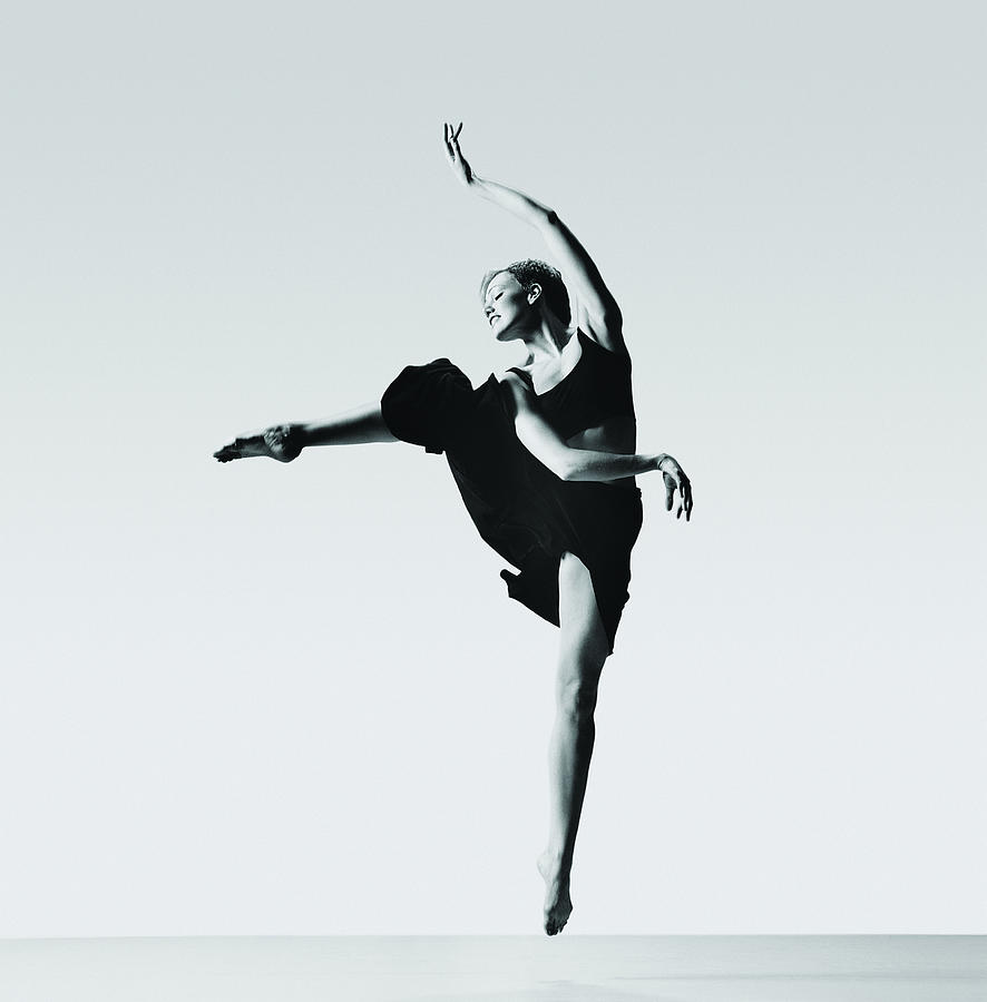 Female Ballerina Jumping On Tiptoe Photograph by Chris Nash