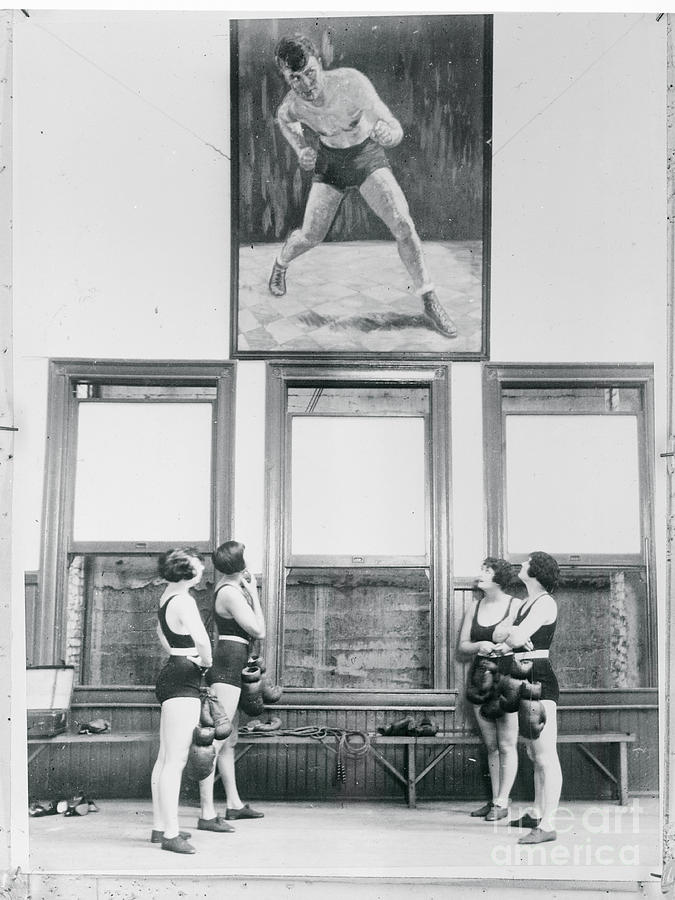Female Boxers Looking At Portrait Photograph by Bettmann