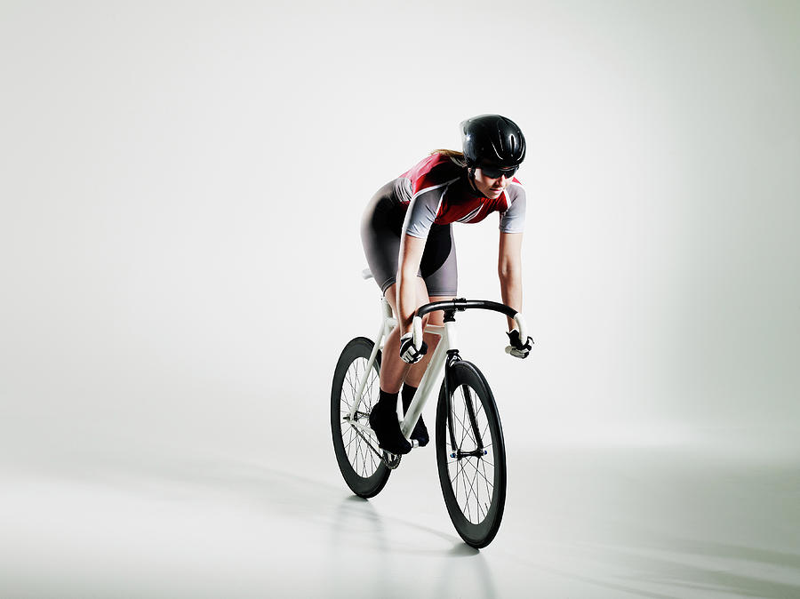 Female Cyclist Riding Track Bike Photograph by Thomas Barwick