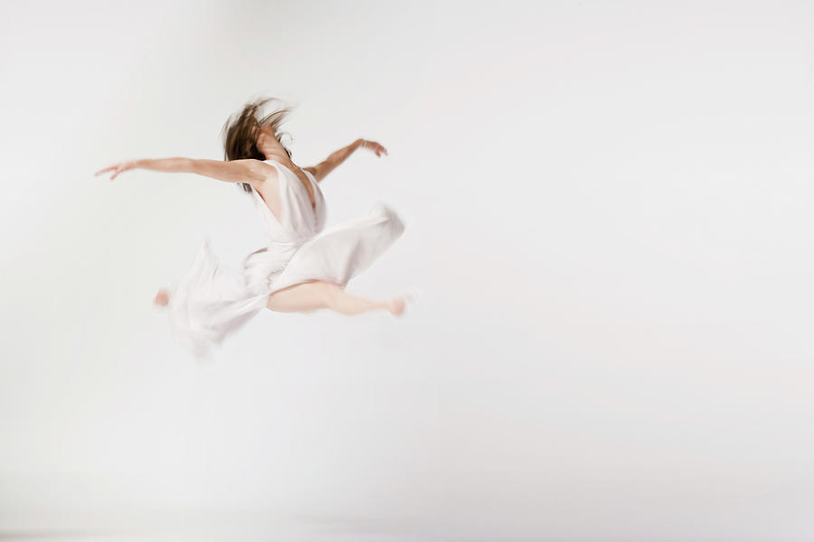 Female Dancer Leaping In Air Blurred Photograph by Mike Powell Female Dancer Leaping In Air Blurred Photograph by Mike Powell