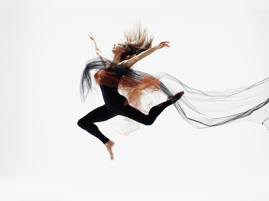 Female Dancer Leaping In Mid Air Photograph by Thomas Barwick