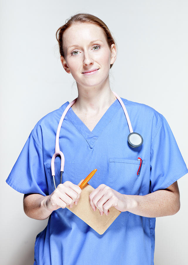 Female Doctor In Scrubs Photograph by James Whitaker