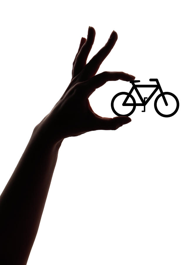 Female Hand Holding A Cycle Photograph by Mattjeacock