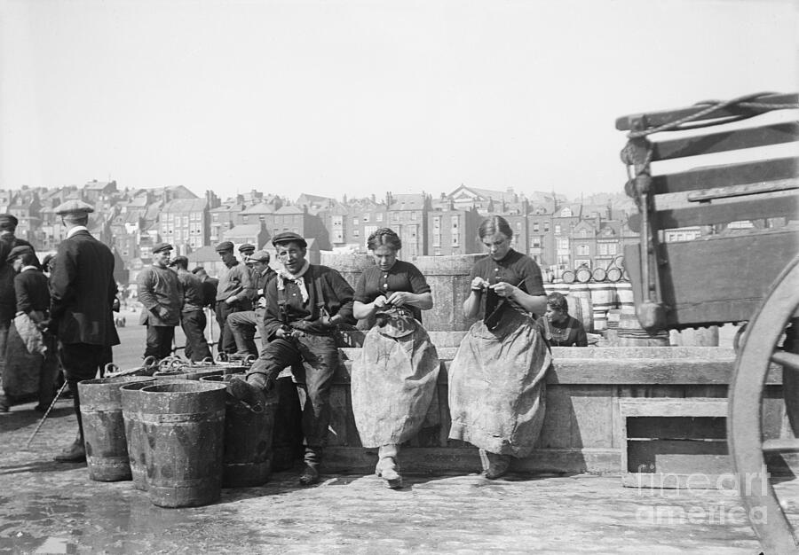Female Herring Fishers, Knitting On The Dock, In Front Of Empty Buckets Waiting For The Return Of Fishing, In Scarborough Yorkshire Photograph by Unknown
