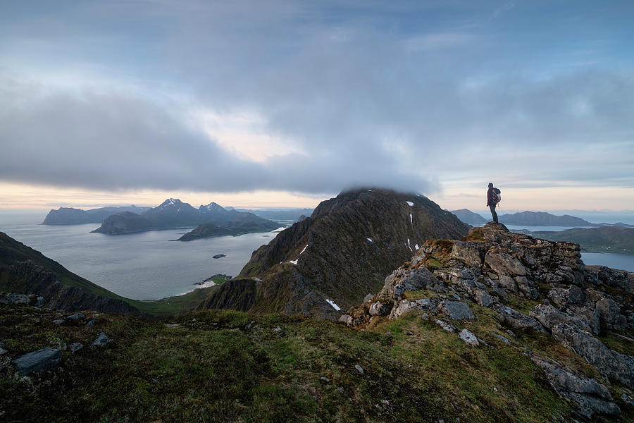 Female Hiker Overlooks Moutain Landscape From Middagstind, Flakstadøy ...