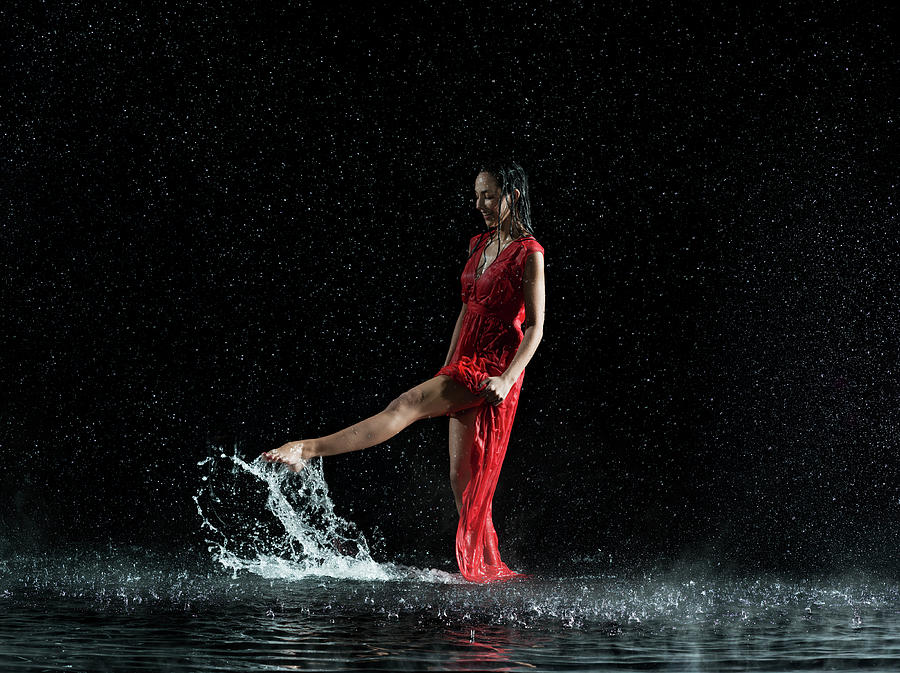 Female In Red, Foot Splashing In Water Photograph by Jonathan Knowles