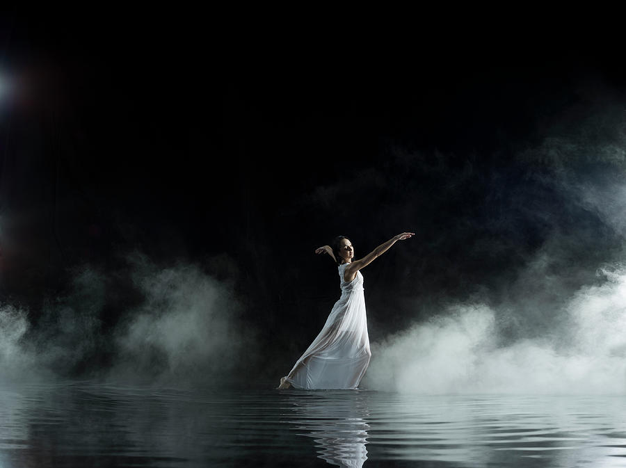 Female In White Dancing In Water, Misty Photograph by Jonathan Knowles