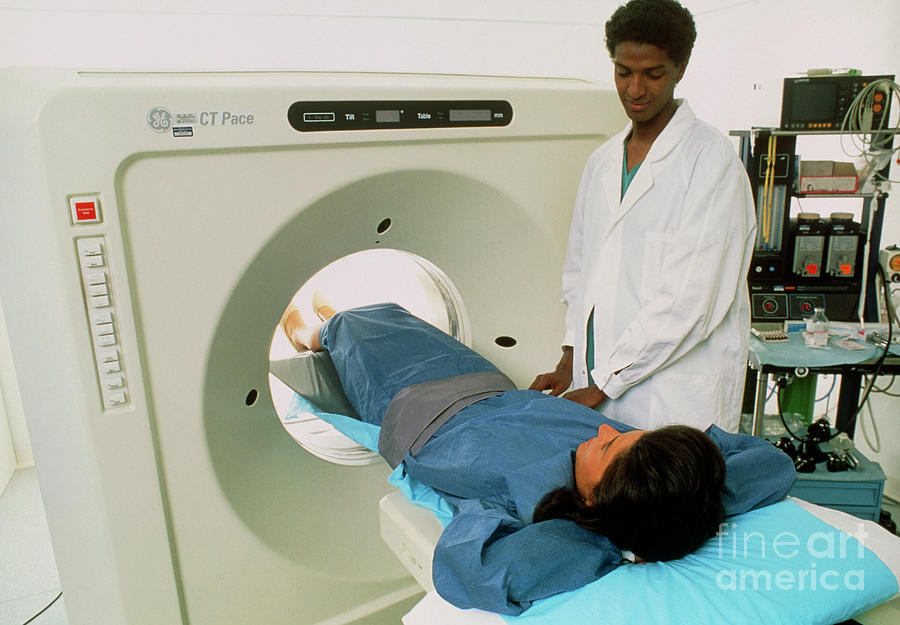 Female Radiologist Moves Patient Into A Ct Scanner Photograph by Mauro Fermariello/science Photo Library