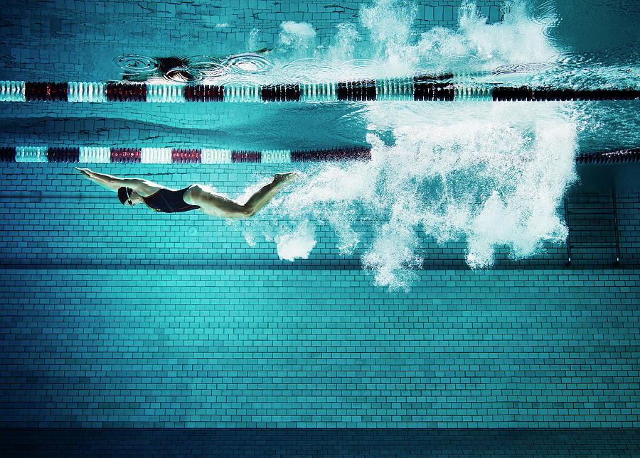 Female Swimmer Underwater In Pool Photograph by Henrik Sorensen