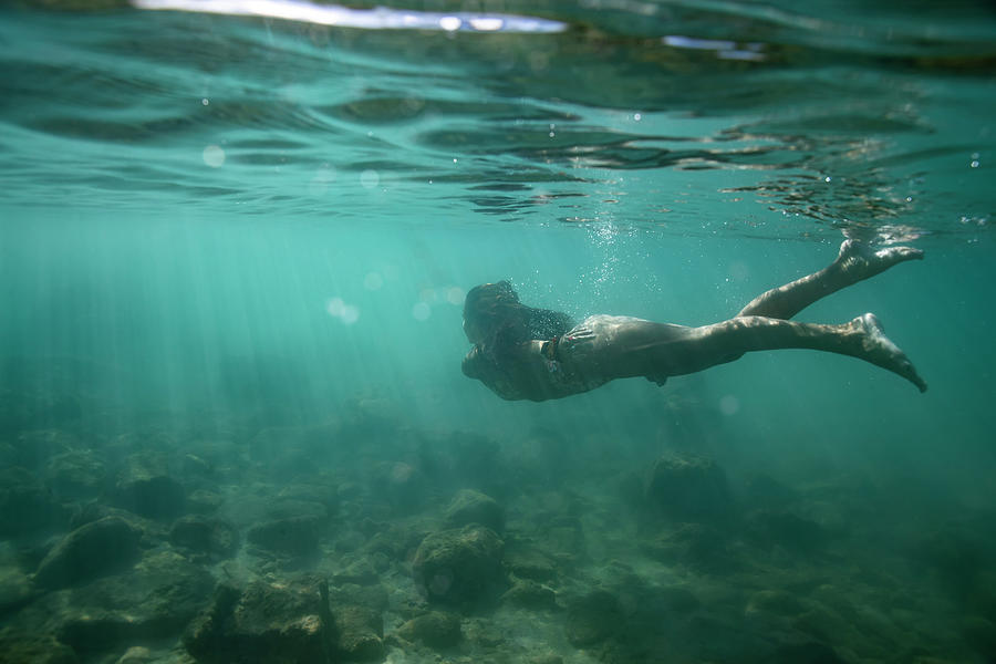 Female Swims Away In Bikini Under The Surface Of Shallow, Clear Waters ...