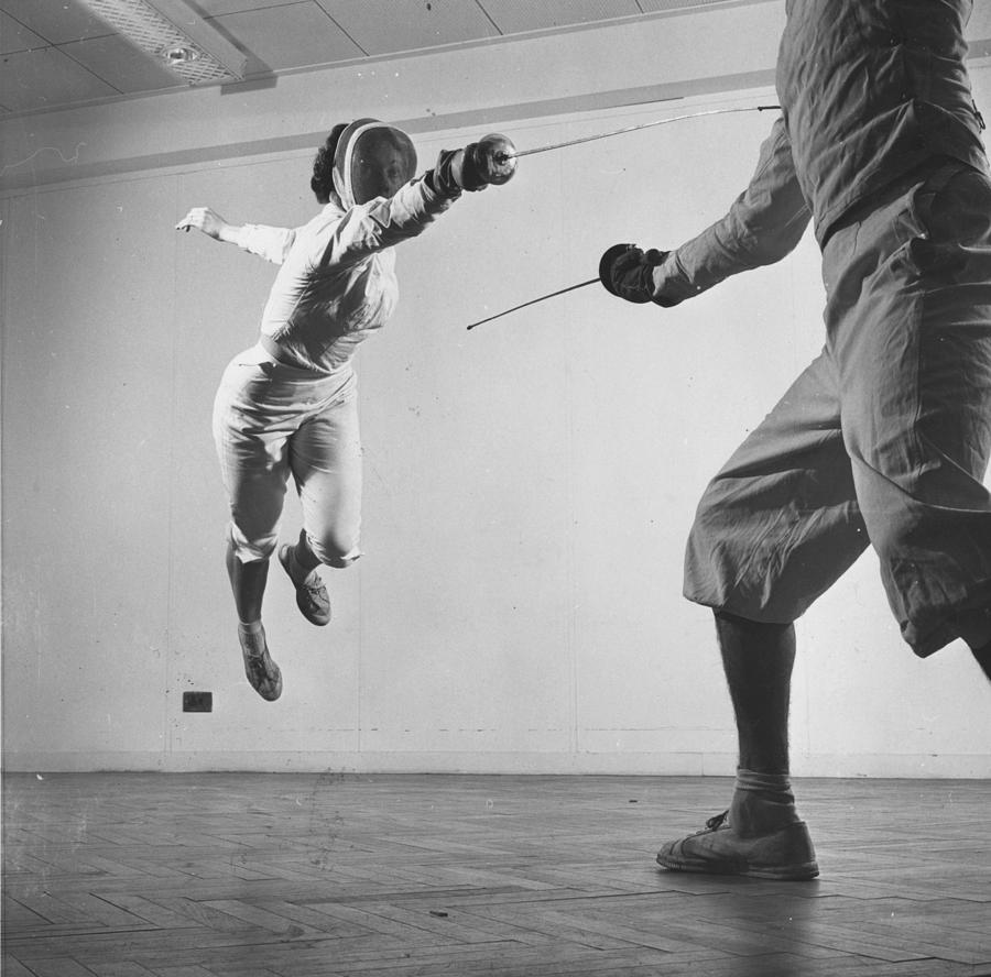 Fencing Leap Photograph by Thurston Hopkins