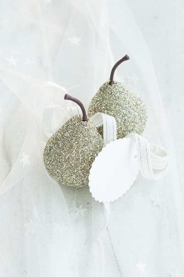 Festive Arrangement Of Glittery Pears And Gift Tag Photograph by Eising Studio