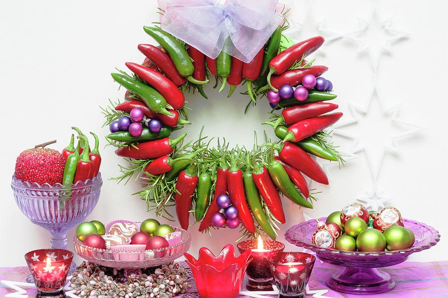 Festive Arrangement With Advent Wreath Made Of Red And Green Chilli Peppers, Baubles, Candles And Stars Photograph by Linda Burgess