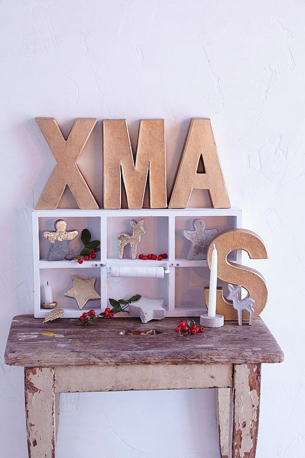 Festive Arrangement With Cardboard Letters Spelling Xmas Photograph by Anke Schtz