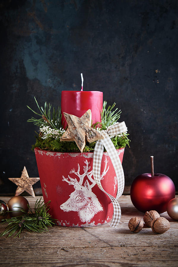 Festive Arrangement With Red Candle In Flower Pot Decorated With White Stags Head Photograph by Brigitte Sporrer